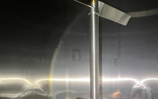 Tank interior after Exelerate enzymatic CIP: bare stainless steel, no surface film.